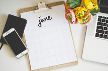 June calendar on a clipboard 