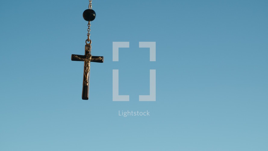 Silhouette of crucifix with sky background
