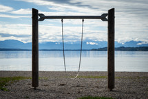 swing on a playground along a shore 