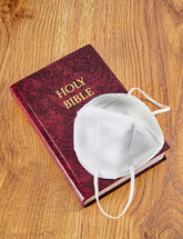 Holy Bible with a mask 