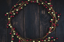gold and red berry wreath 