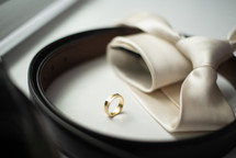 gold wedding ring and tie 