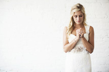 bride with praying hands 