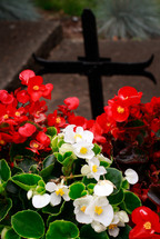 cross in a flower garden 