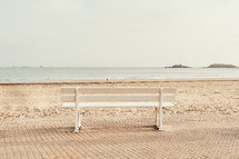 park bench on a beach 