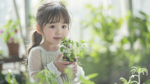 Curious child with plant, sunlight greenhouse setting.