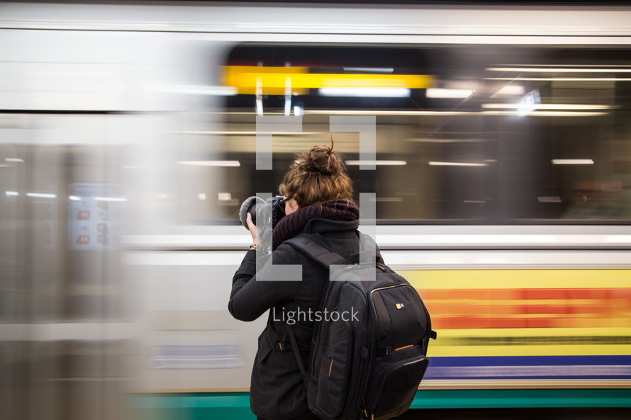 taking a photograph of a passing train 