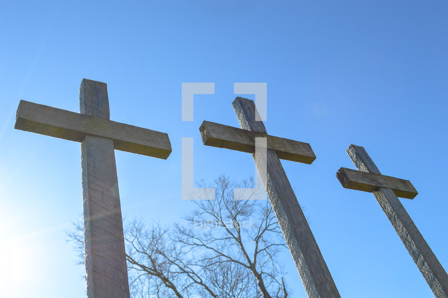 three crosses against a blue sky 
