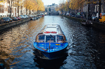 a water taxi on a channel in Amsterdam 