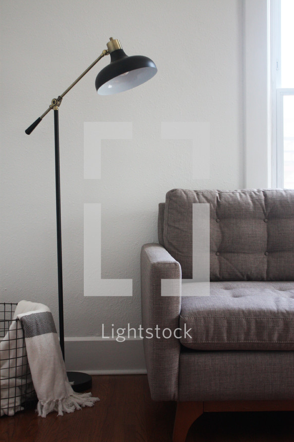 a lamp over a couch 