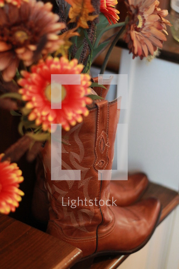 gerber daisies in cowboy boots 