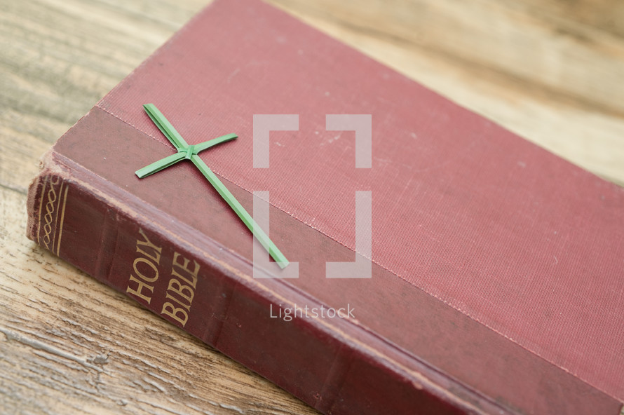 Flax cross on a Bible.