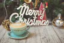 Merry Christmas sign and latte 