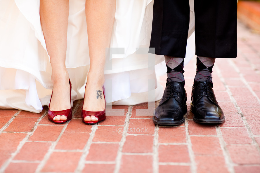 Close up of bride and groom's wedding shoes