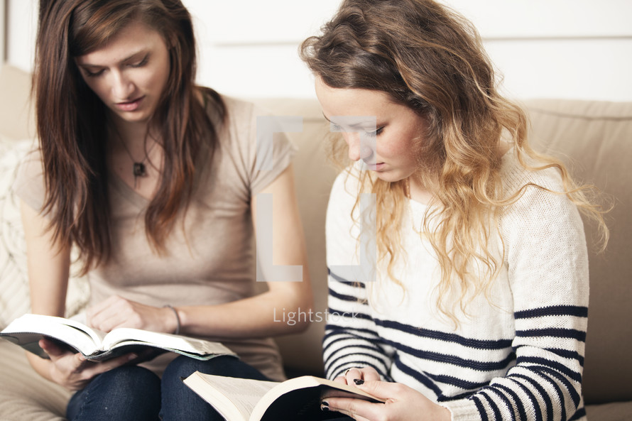 Friends reading Bibles together. 
