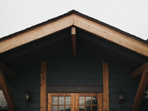 Awning of rustic home with wood beams