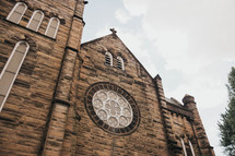 the outside of an old catholic church building