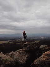 man at the top of a mountain 