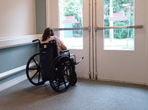 a woman alone in a wheelchair 