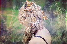 woman with butterflies in her hair 