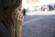 a young woman talking on her cellphone 