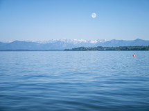 full moon over the Alps and lake