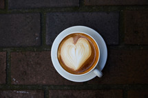 heart shape in creamer in coffee 