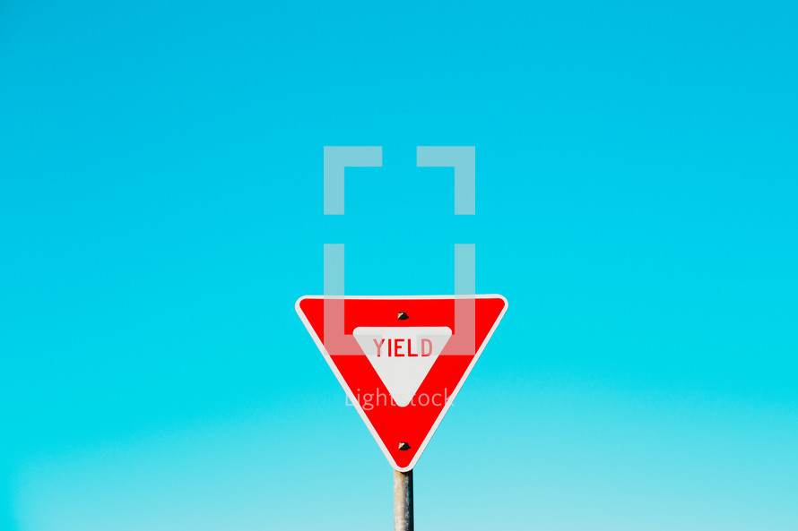 yield sign and blue sky 