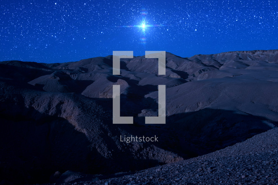 bright star over a desert landscape at night 