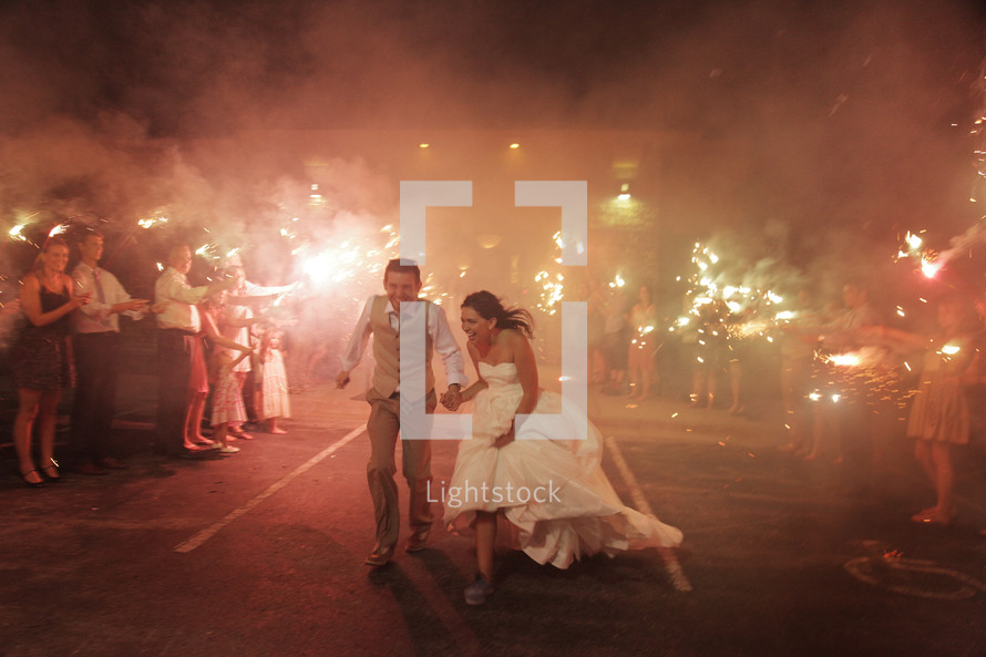 bride and groom and sparklers 