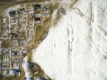 aerial view over rural farmland covered in snow 