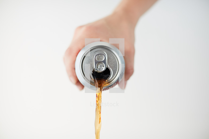 a man pouring out a soda 