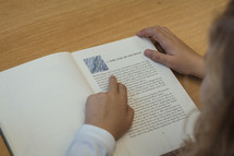 a child reading a book 