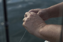 a fisherman holding a line 