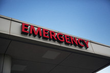 An emergency sign on a hospital building.