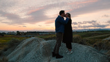 Young Couple Outdoor Under Sunset Sky