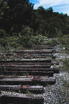 old wooden railroad beams from an abandoned track 