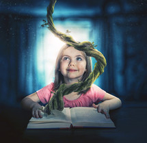 A child reads a story and uses her imagination to get into the story