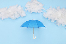 blue umbrella against a blue sky 