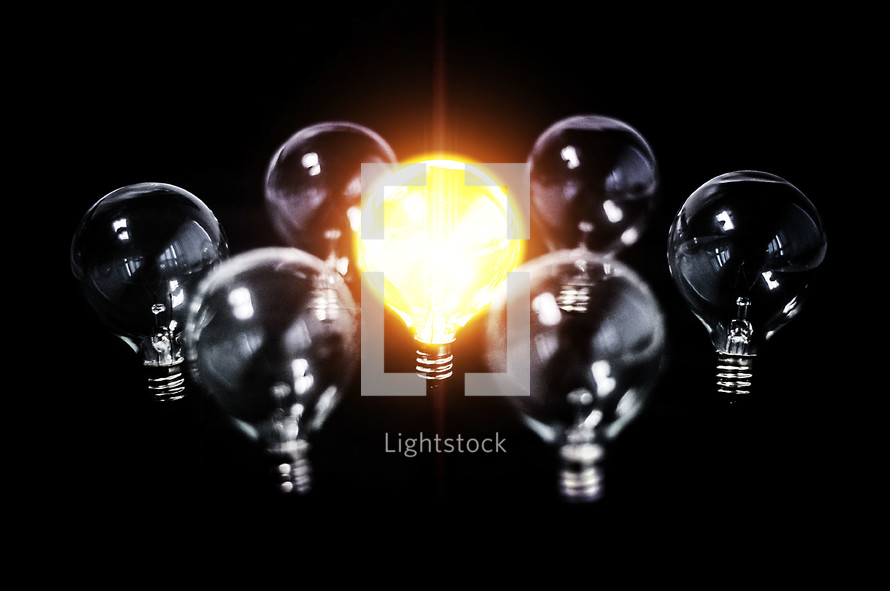 Bright lightbulb among other inactive bulbs