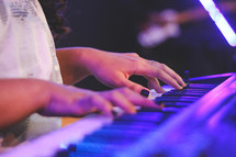 woman playing a digital keyboard 