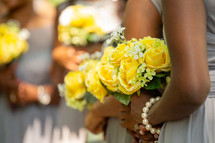 bridesmaids holding roses 