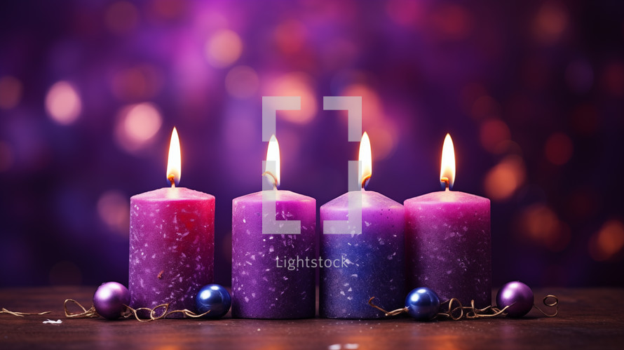 Four purple advent candles with bokeh background. 