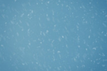 Falling snow on blue background.