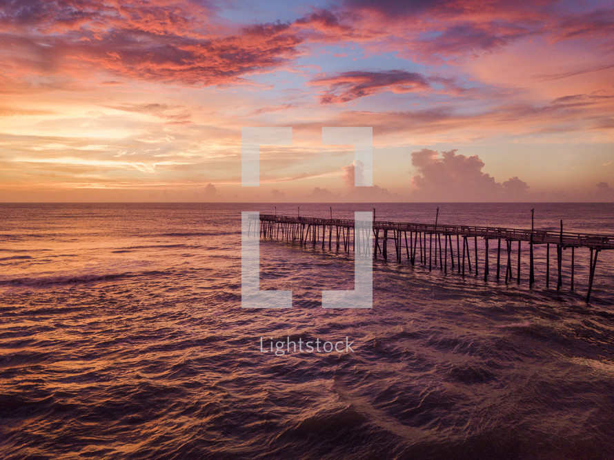 rustic pier at sunset 