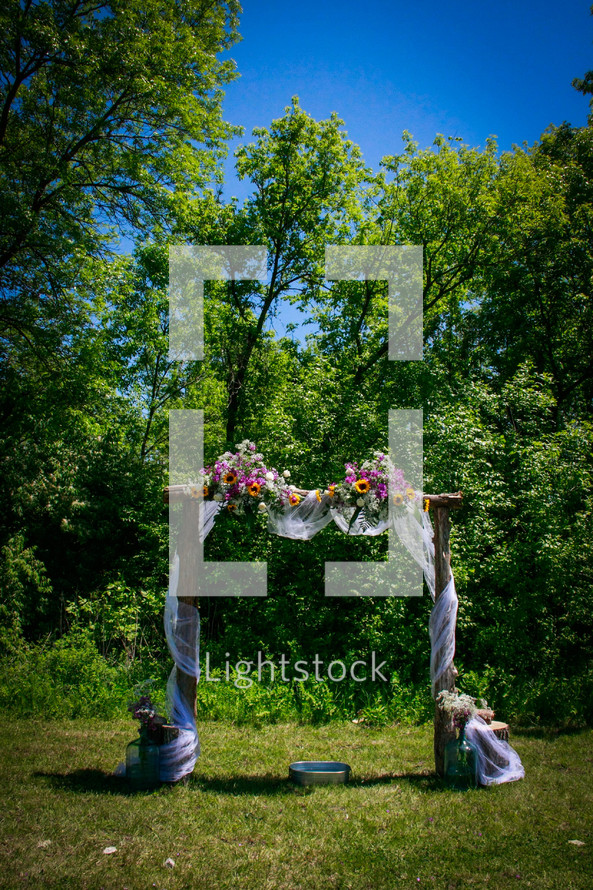 flowers on an archway for a wedding ceremony 