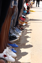 row of kids' feet 