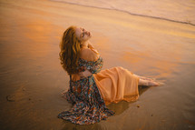 a model posing on a beach 