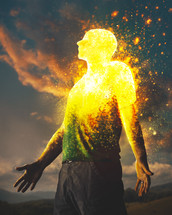 A surreal image of a man being transformed into beautiful glowing light