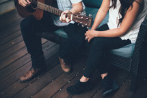 couple, sitting, porch, deck, bench, man, woman, playing, guitar, music 
